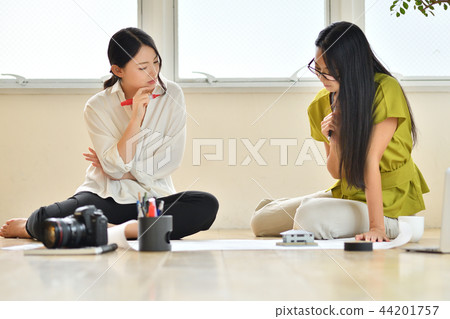 Two women colleagues in creative work Two women colleagues in creative work 44201757