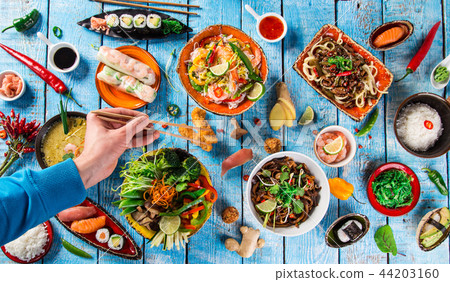 Various of asian meals on rustic background , top view , place for text. Various of asian meals on rustic background , top view , place for text. 44203160