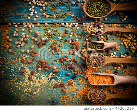 Raw legume on old rustic wooden table. Raw legume on old rustic wooden table. 44203239