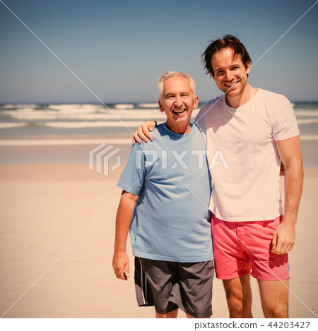 Portrait of smiling family at beach Portrait of smiling family at beach 44203427