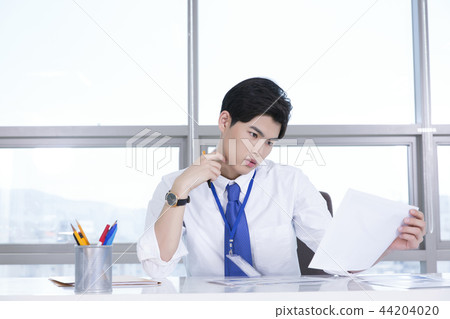 A day of young businessman in the office 137 44204020