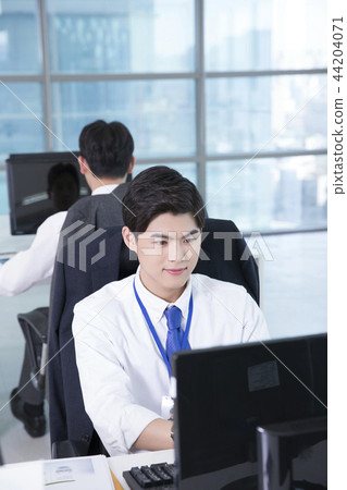 A day of young businessman in the office 127 44204071