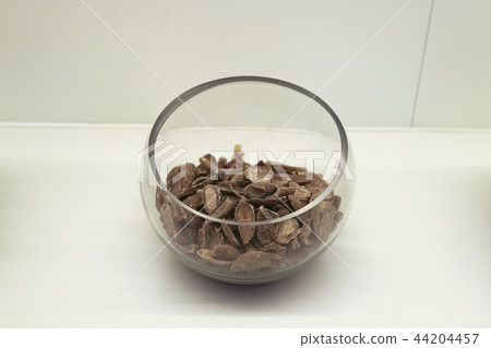Chinese traditional medicine, dry leaves in glass bowl white isolated background. 116 Chinese traditional medicine, dry leaves in glass bowl white isolated background. 116 44204457