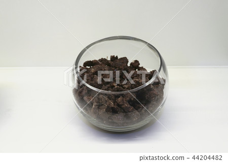 Chinese traditional medicine, dry leaves in glass bowl white isolated background. 101 Chinese traditional medicine, dry leaves in glass bowl white isolated background. 101 44204482