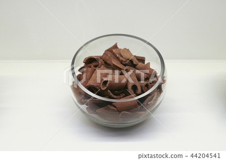 Chinese traditional medicine, dry leaves in glass bowl white isolated background. 099 Chinese traditional medicine, dry leaves in glass bowl white isolated background. 099 44204541
