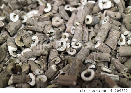 Chinese traditional medicine, close up dry herbs or leaves top view 140 Chinese traditional medicine, close up dry herbs or leaves top view 140 44204712