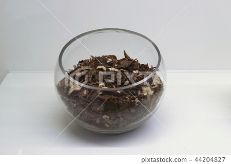 Chinese traditional medicine, dry leaves in glass bowl white isolated background. 106 Chinese traditional medicine, dry leaves in glass bowl white isolated background. 106 44204827