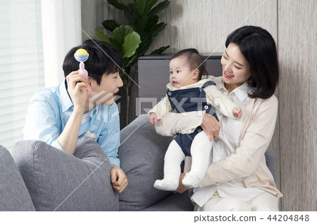 Young parents enjoying time spent with their little daughter, love and happy family concept photo 050 Young parents enjoying time spent with their little daughter, love and happy family concept photo 050 44204848