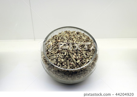 Chinese traditional medicine, dry leaves in glass bowl white isolated background. 088 Chinese traditional medicine, dry leaves in glass bowl white isolated background. 088 44204920