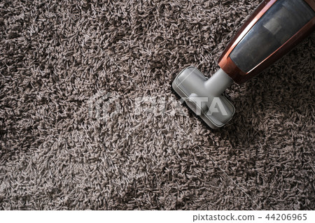 Close-up Of man  using A Vacuum Cleaner 44206965
