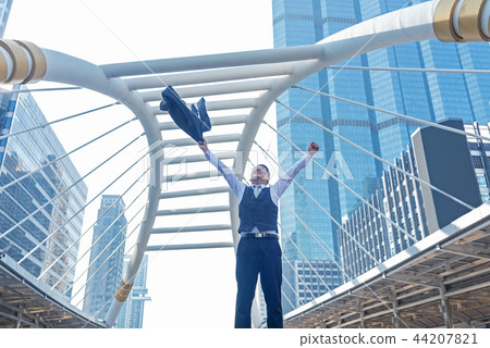 Celebrating success. Businessman keeping arms  44207821