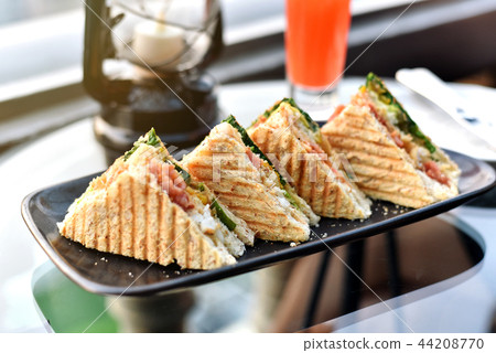 Sandwiches on plate, Grilled bread with lettuce. 44208770