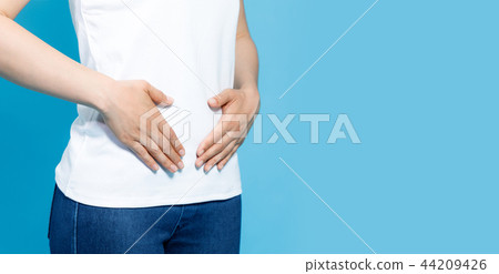 A woman putting her hands on her stomach 44209426