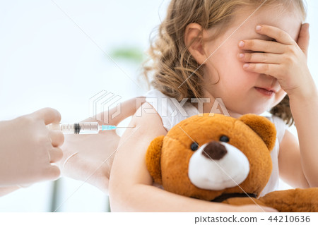 vaccination to a child 44210636