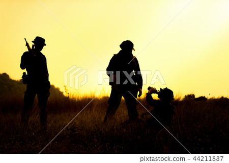 Soldier holding weapons overhead after get victory Soldier holding weapons overhead after get victory 44211887
