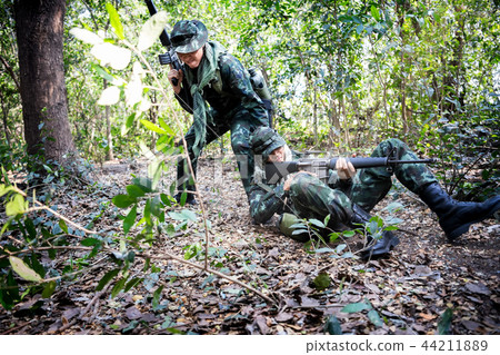 Asian army soldier during rescue operation evacuat Asian army soldier during rescue operation evacuat 44211889