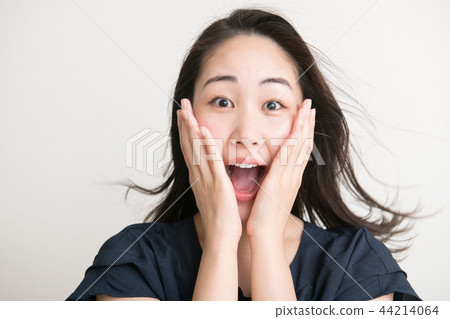 Surprised young Japanese woman facial expression shock shock 44214064