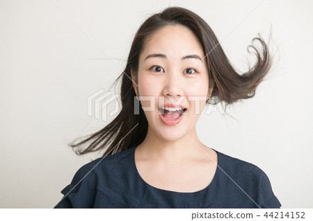 A surprised young Japanese woman look surprise 44214152