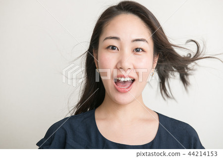 Surprised young Japanese woman look surprise 44214153
