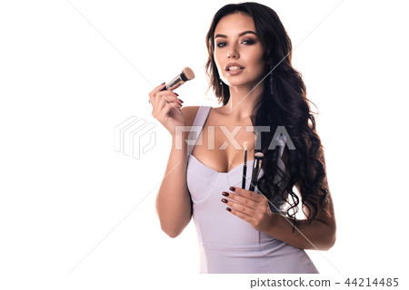 Portrait of beautiful woman with make-up brushes 44214485