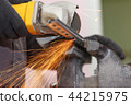 Cuts metal with a cutting machine. Close-up view 44215975