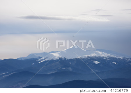 Mountain top under snow 44216779