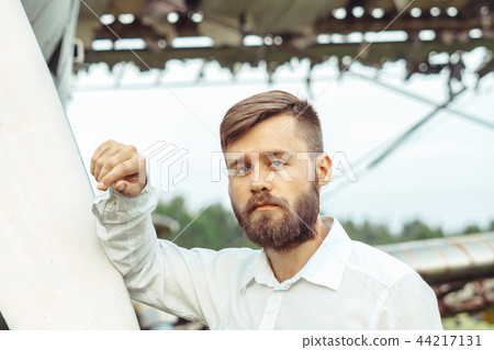a man on the background of an old plane 44217131