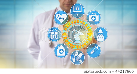 Male Physician Operating Surgical Robot Via App Male Physician Operating Surgical Robot Via App 44217660
