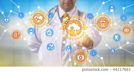 Male Doctor Synchronizing Data Via SaaS Interface Male Doctor Synchronizing Data Via SaaS Interface 44217661