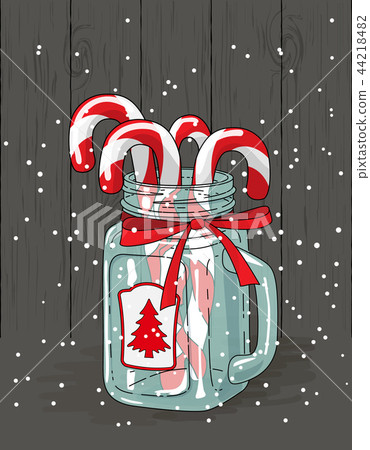 Christmas theme, candy canes in glass jar with red Christmas theme, candy canes in glass jar with red 44218482