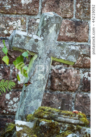 stoned cross on abandoned tomb in cemetery stoned cross on abandoned tomb in cemetery 44219092