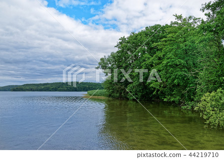 Nature scene of a lake against cloudy sky Nature scene of a lake against cloudy sky 44219710