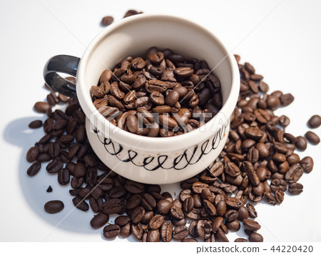 Coffee cup with coffee beans Coffee cup with coffee beans 44220420