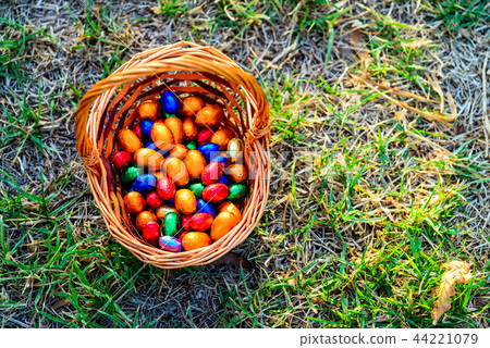 Chocolate eggs in basket Chocolate eggs in basket 44221079