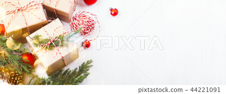 Christmas gift boxes collection with evergreenes and red Christmas balls. 44221091