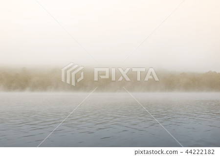 The mist in the lake in the morning. 44222182