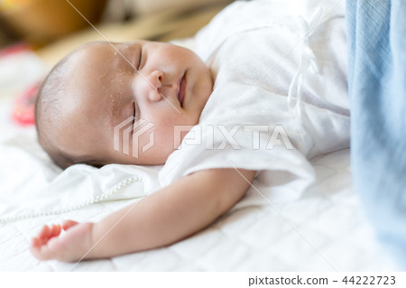 Sleeping face of a newborn baby 44222723