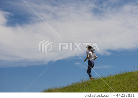 A woman who jogs A woman who jogs 44222831