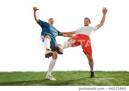 Football players tackling for the ball over white background 44223868