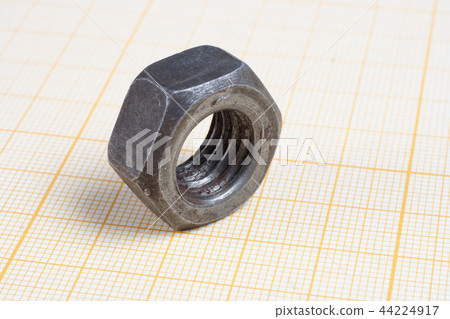 Screw and Nuts on graph paper background 44224917