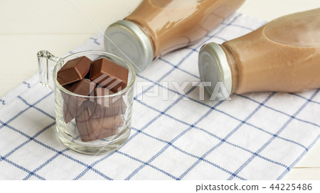 Chocolate milk on a white wooden table. 44225486