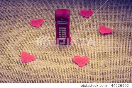 Red hearts around red color phone booth Red hearts around red color phone booth 44226992