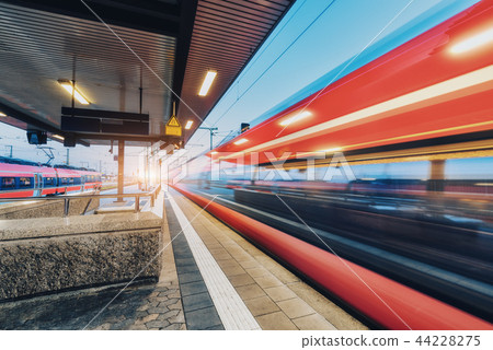 High speed train in motion on the railway station  44228275