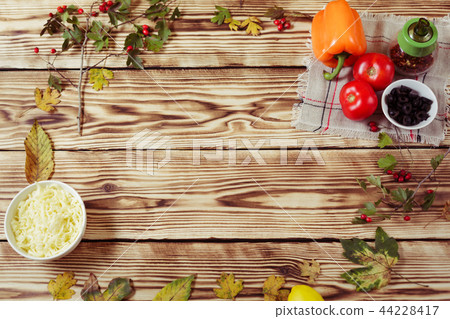 Composition with autumn leaves,cooking ingridients 44228417