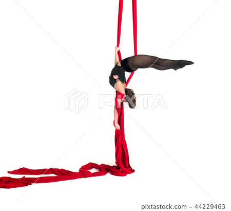 Woman hanging in aerial silks, isolated on white 44229463