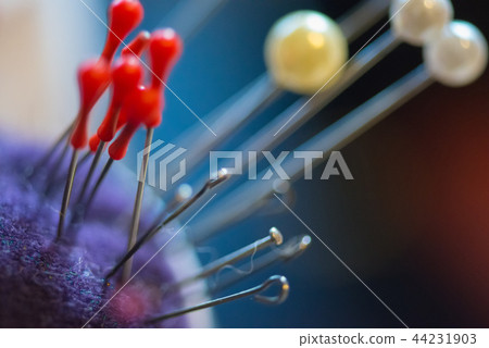 Set of threads in the bobbin on colorful background Set of threads in the bobbin on colorful background 44231903