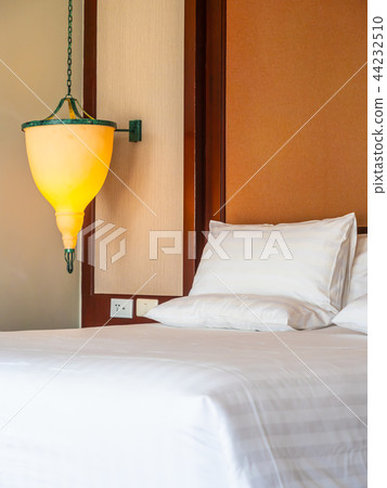 Comfortable pillow on bed decoration in hotel bedroom Comfortable pillow on bed decoration in hotel bedroom 44232510