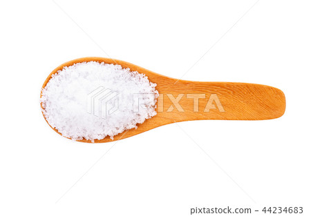 Sea salt in wooden spoon on white background Sea salt in wooden spoon on white background 44234683