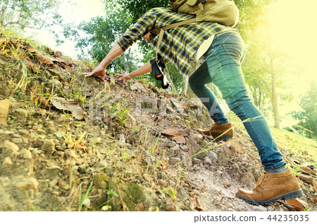 man  walk in the forest for their travel 44235035