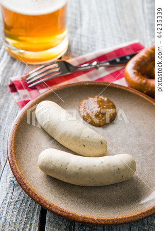 The bavarian weisswurst, pretzel and mustard. 44235339